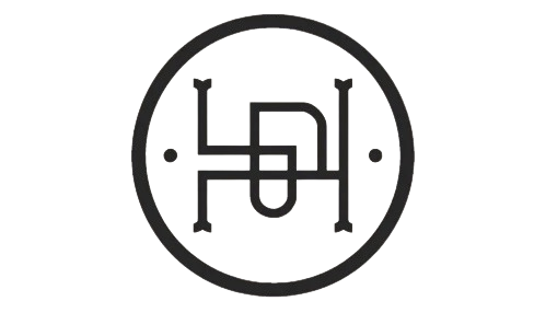 Hamsa emblem — an interlocking H monogram inside a circular seal